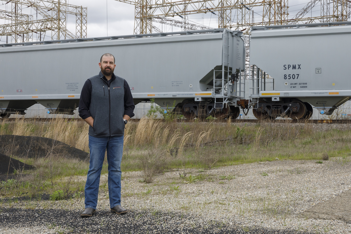 Jesse Roush stands at an industrial site in Marietta