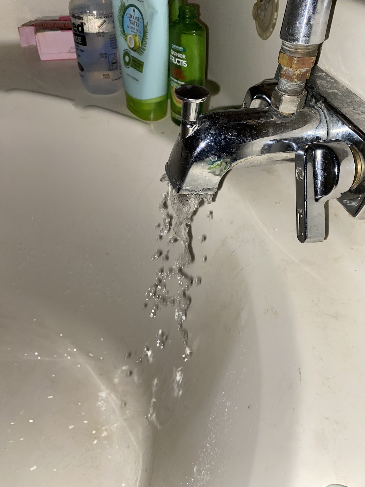 Photo of a running bathroom faucet